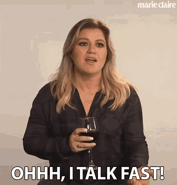 a woman is holding a glass of wine and saying ohhh , i talk fast
