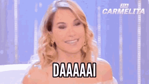 a woman in a white dress is making a funny face and says daaaai