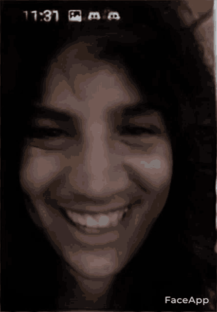 a close up of a woman 's face with a face app app on her phone