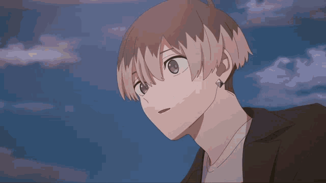 a close up of a person 's face with the sky in the background