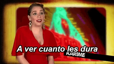 a woman in a red dress stands in front of a sign that says a ver cuanto les dura