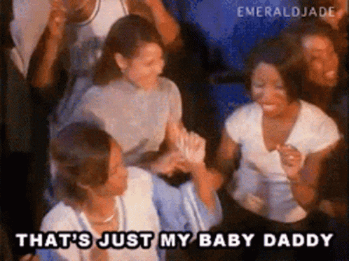 a group of people are dancing in a crowd and one of them is saying that 's just my baby daddy .
