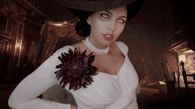 a woman wearing a white dress and a hat with a flower on her chest