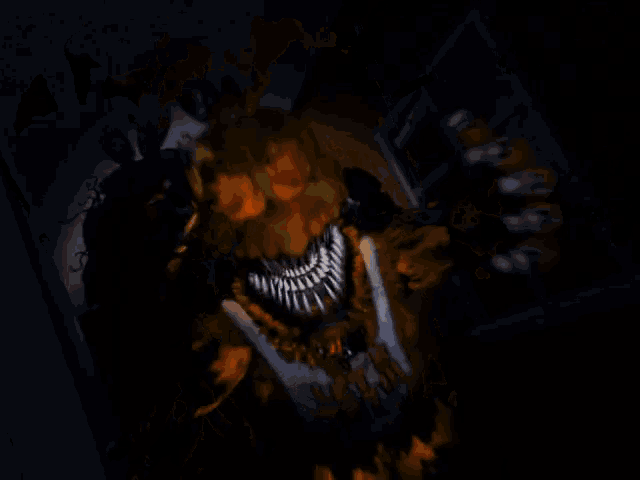 a picture of a monster with glowing teeth and a glowing face