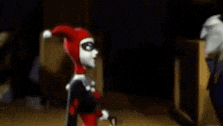 harley quinn and the joker are standing next to each other and the joker is saying `` baby , you 're the best ''