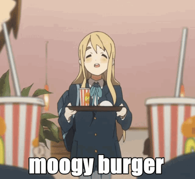 a girl holding a tray of food with the words moogy burger written on the bottom