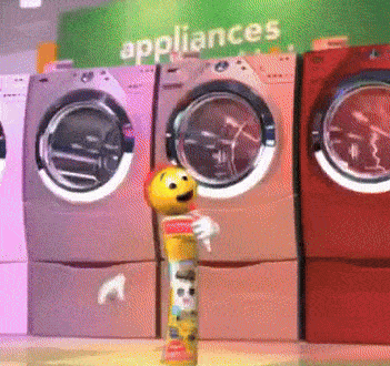 a row of washing machines in a laundromat with appliances written on the wall behind them