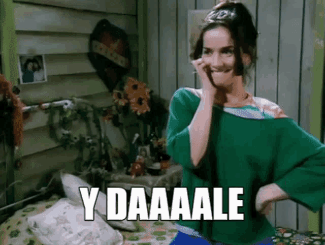 a woman in a green shirt is making a funny face and the words y daaaale are on the bottom