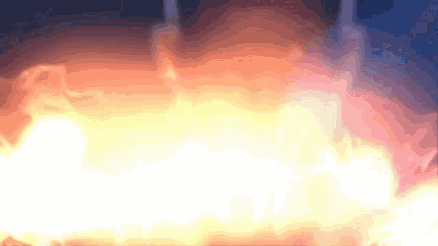 a close up of a fire with a dark background