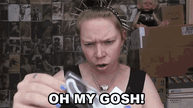 a woman with spikes in her hair says oh my gosh while holding something