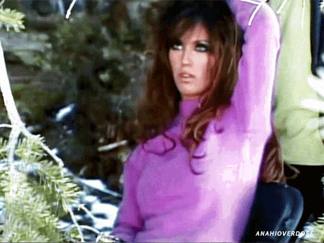 a woman in a purple sweater with the hashtag anahioverdose on the bottom right