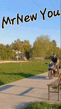 a man riding a motorcycle in a park with the words mr new you written above him