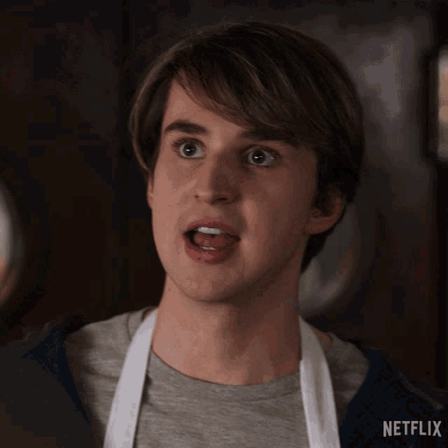 a man with an apron on says thank you