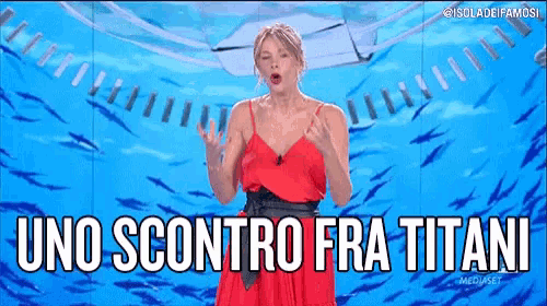 a woman in a red dress is standing in front of a screen with the words uno sconto fra titani written on it .