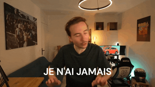 a man in a room with the words je n'ai jamais written on the bottom
