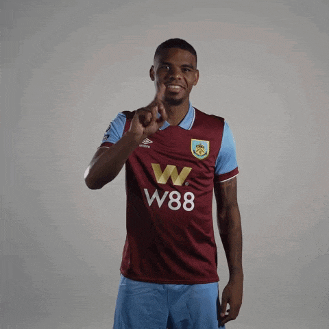 a man wearing a maroon and blue w88 jersey
