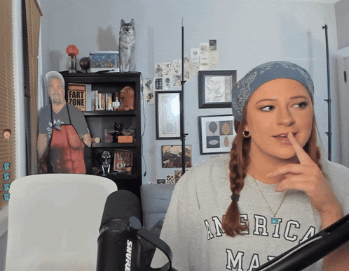 a woman wearing a grey shirt that says america ma
