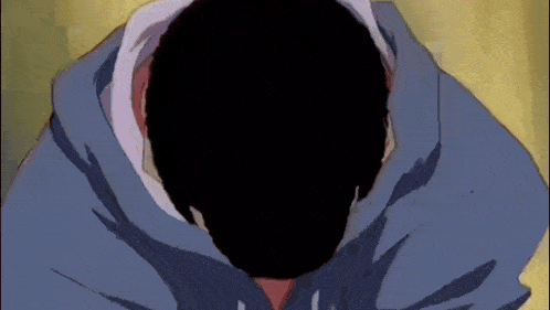 a man in a blue hoodie with a black face .