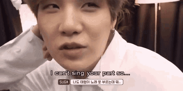 a close up of a person 's face with the words `` i can 't sing your part so ... ''