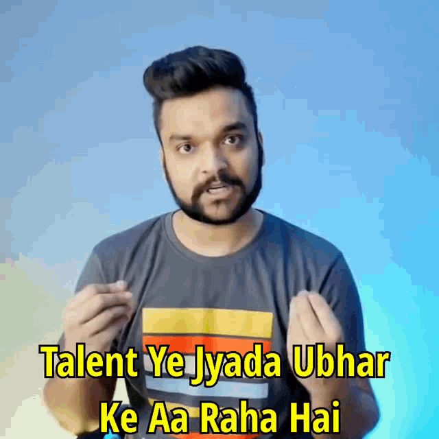 a man with a beard is wearing a shirt that says talent ye jyada ubhar ke aa raha hai