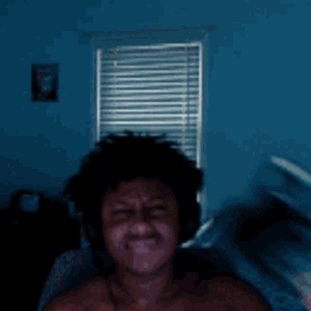 a man wearing headphones is taking a selfie with his camera