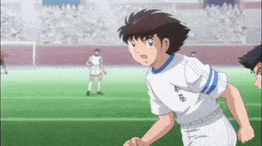 a soccer player wearing a white jersey with chinese writing on it