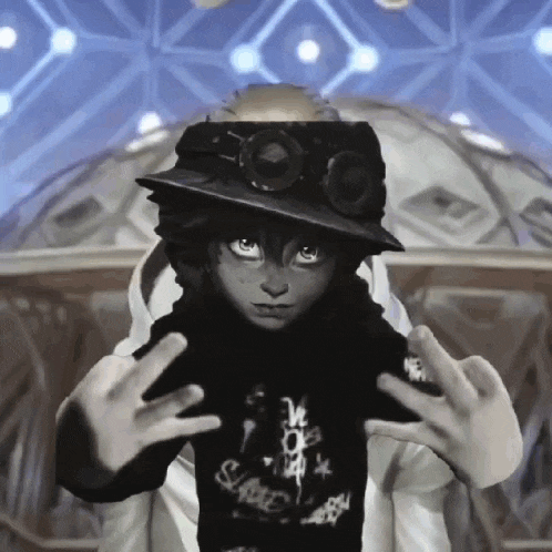 a person wearing a hat and goggles is making a funny face .