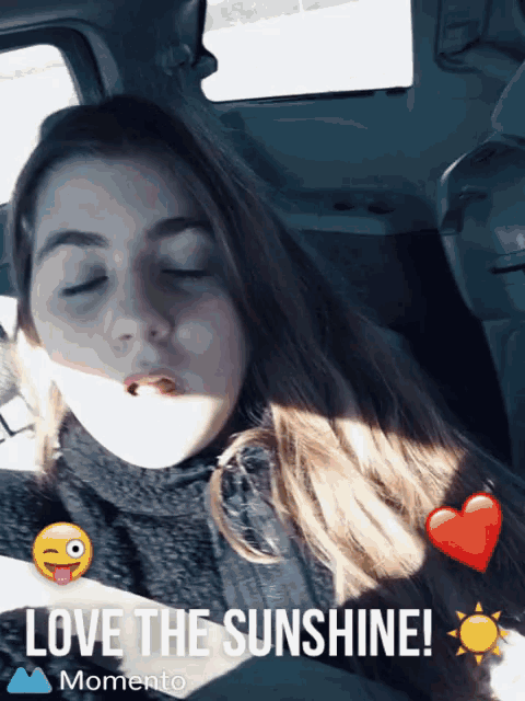 a girl in a car with the words love the sunshine momento