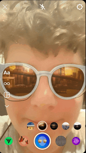 a person wearing sunglasses with the letters aa and infinity visible