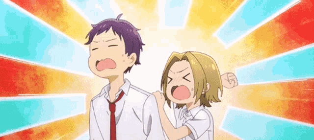 a boy and a girl are standing next to each other and the girl is giving the boy a fist bump .