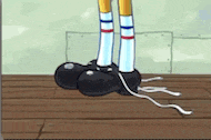 a cartoon character is standing on a wooden floor with a pair of black shoes on .
