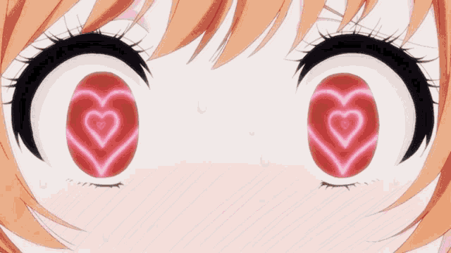 a close up of a girl 's eyes with a heart in them