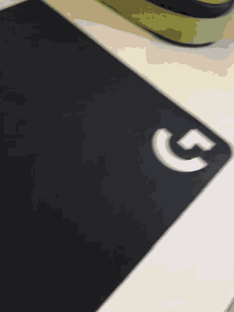 a shadow of a person is cast on a white surface