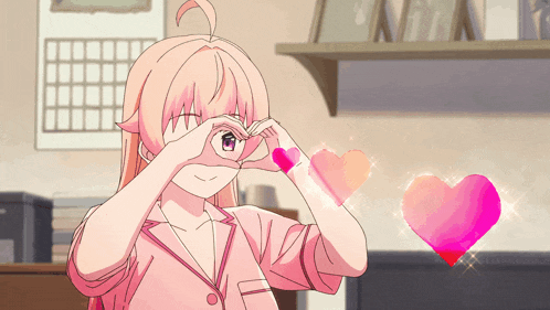 a girl making a heart shape with her hands in front of her eyes
