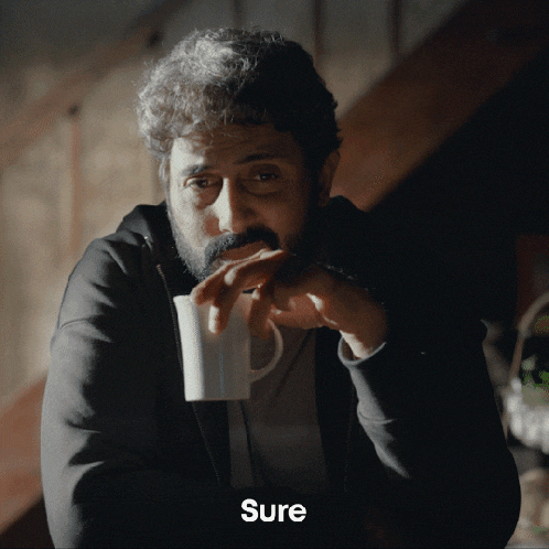 a man with a beard is drinking from a white mug and the word sure is on the bottom