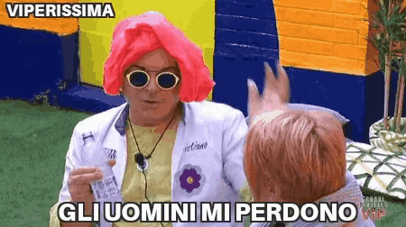 a man wearing a pink wig and sunglasses says viperissima