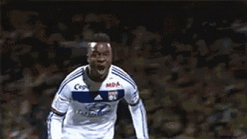 a soccer player wearing a jersey that says ' cisco ' on it stands in front of a crowd