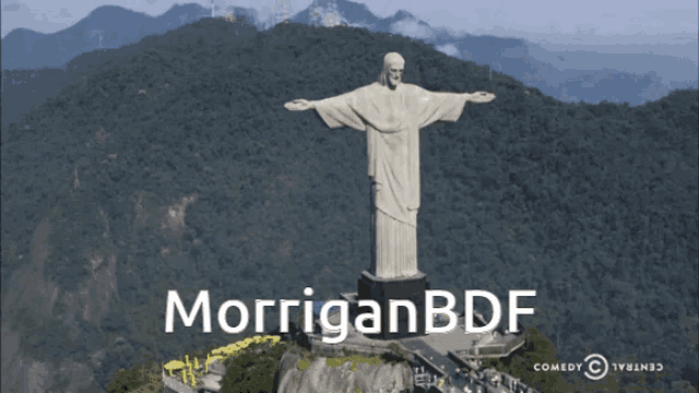 a statue of jesus on top of a mountain with the name morrigan bdf below it