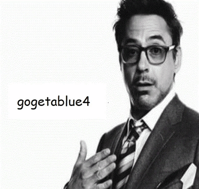 a black and white photo of a man in a suit and tie with the words gogetablue4 on the bottom
