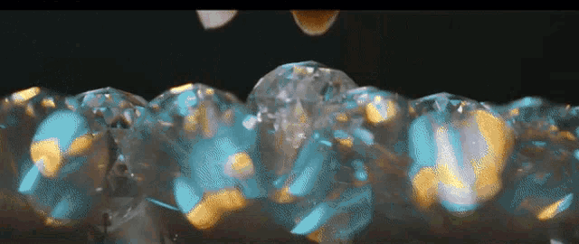 a close up of a bunch of ice cubes on a black background