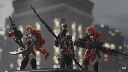 three action figures with red hair are holding guns and swords