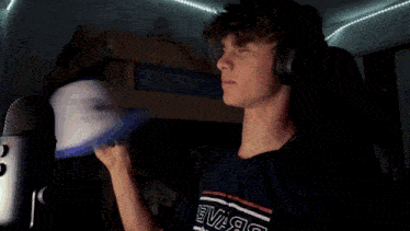 a man wearing headphones and a t-shirt that says 2f1 on it