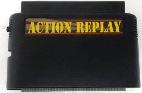 a black action replay cartridge sits on a white table