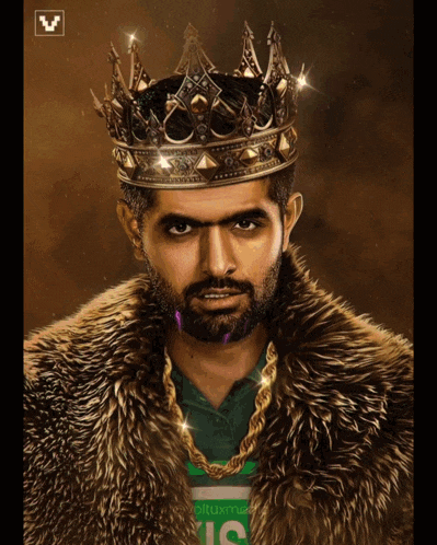 a man wearing a fur coat and a crown has a shirt that says us on it