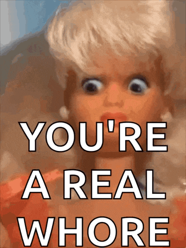 a picture of a doll with the words " you 're a real whore " on it