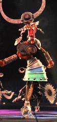 a robot with horns is standing on a stage with a purple background
