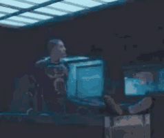 a blurred image of a person laying on a table with flames coming out of them