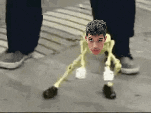 a person standing next to a skeleton with a man 's face on it
