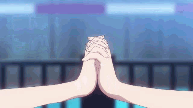 a couple of hands are holding each other in a circle