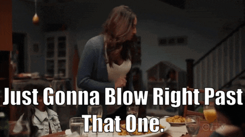 a woman sitting at a table with the words just gonna blow right past that one written below her